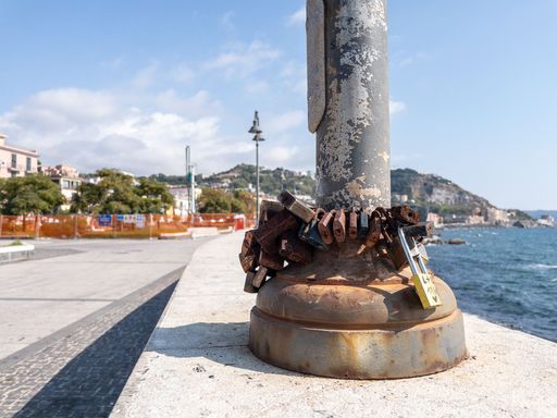 Concept of romance and commitment with padlocks tied to a post