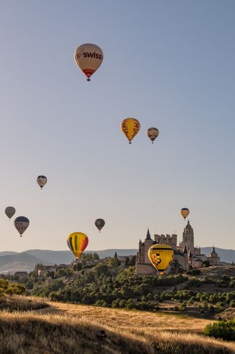 A vertical shot of the festival of hot air balloons in Segovia in Spain