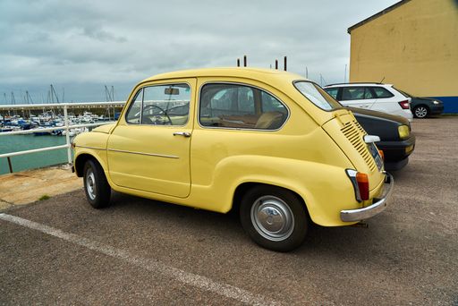 A vintage yellow SEAT car on a parking near the beach in Ramsgate, UK