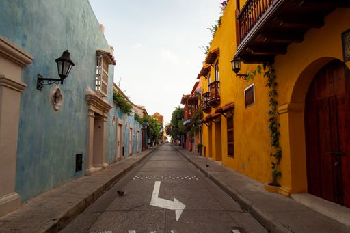Empty street during the morning hours in Cartagena, Colombia. The historic Spanish-style buildings are very colorful.