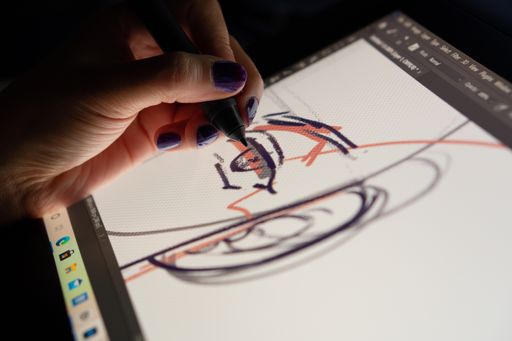 Animator designer drawing sketching development creating graphic pose characters, animation design studio. Caserta, Italy, July 22th 2021.