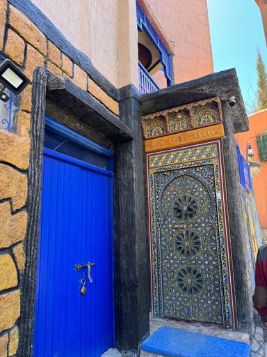 A beautifully decorated entrance with intricate patterns and vibrant colors in Imlil, Morocco