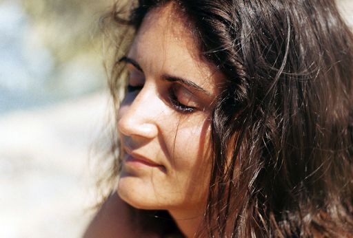 A closeup shot of a beautiful Hispanic woman with closed eyes