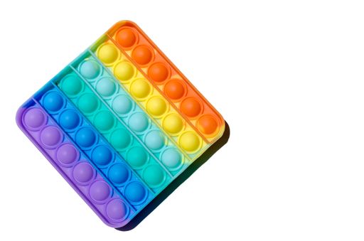 A closeup shot of a colorful pop It Fidget toy isolated on a white background