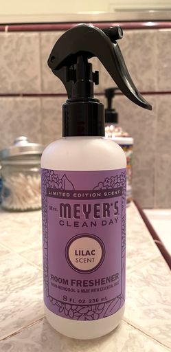 A vertical shot of Meyer's Lilac scented room spray bottle on a bathroom counter