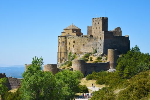 A beautiful view of Loarre Castle in Loarre, Spain against a clear blue sky