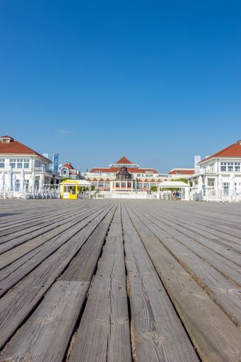 A vertical shot of buildings on the wooden pier of Elbla, Poland