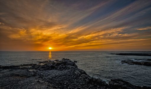 A stunning sunset over the sea with vibrant colors in the sky