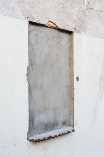 A vertical shot of a cement wall