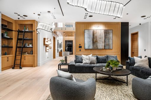 Modern living room interior with stylish furniture, wooden accents, and contemporary decor.
