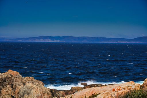 A beautiful shot of the sea under a blue sky in La Coruna in Galicia, Spain