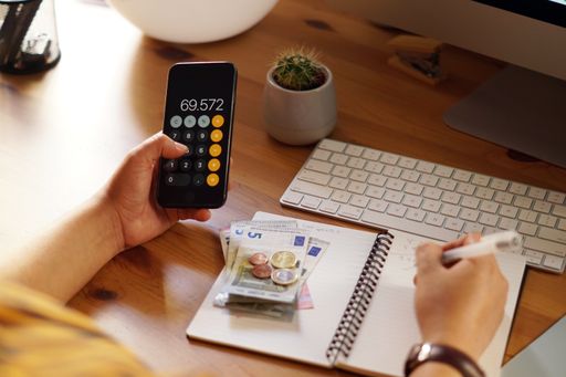 A closeup shot of an entrepreneur working from home on his personal finances and savings