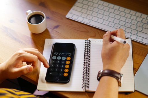 A closeup shot of an entrepreneur working from home and doing calculations