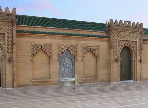 A traditional fountain and door decorated in  Moroccan and Islamic design at the Hassan tower and mosque in Rabat, Morocco.