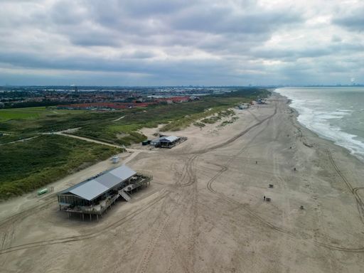 An aerial view of the beach at Monster, the Netherlands on a cloudy day