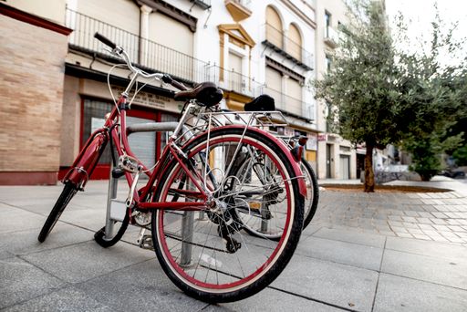 A parking lot of bicycles in a city