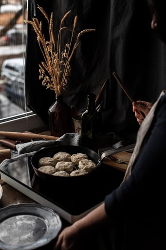 A vertical shot of the process of cooking delicious pastry on a pan