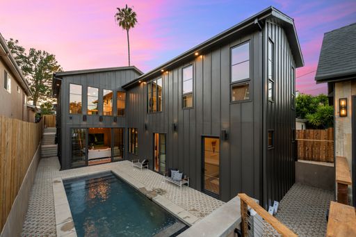 A modern home with a pool at sunset. Southern California