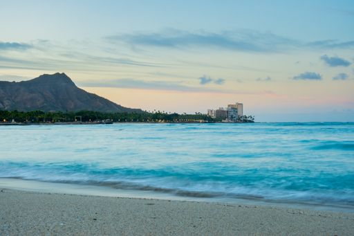 A high angle shot of Waikiki Beach sunrise with Diamond Head in the background