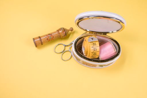 A set of sewing tools isolated on a yellow background with free space for text