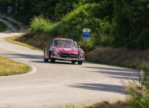 A scenic view of a Mercedes-Benz 300 SL vintage car in Pesaro, Italy