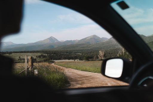 A selective of a beautiful landscape from a window of a car