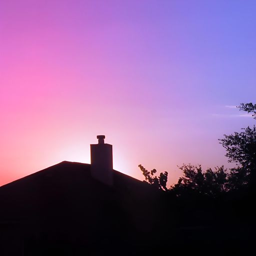 Silhouette of a house and trees against a vibrant pink and purple sunset sky.