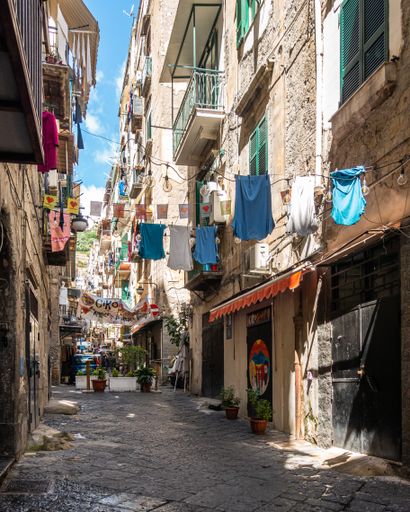 Naples, Italy, May 2021 - A typical narrow alley of Quartieri Spagnoli (Spanish Neighborhoods) in Naples historic center