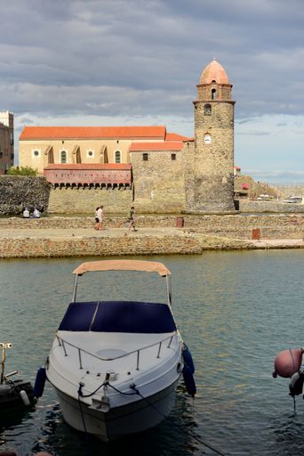 A beautiful view of the city of Collioure in Occitania with the Church of Our Lady of Angels, France