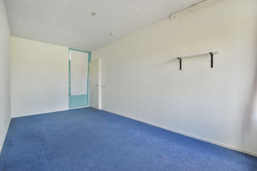 The interior of a beautiful modern house, an empty room with blue carpet