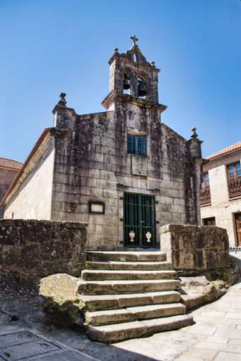 A vertical shot of the beautiful rusted Church of San Roque in Combarro, Spain