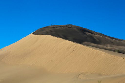 A golden sands of a singing dune in the national park of Kazakhstan