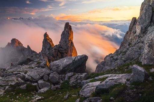 Summer landscape view of a rock formation at sunset as the fog came in, picking up orange colours