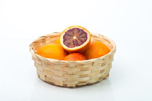 A basket of blood oranges isolated in the white background