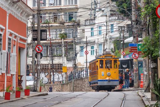 A view of a railway with a yellow train on it in Rio de Janeiro, Brazil