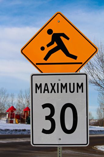 A Playground Zone with Maximum Speed Limit Sign