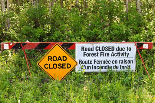 A sign saying that the road is closed due to the fire activity