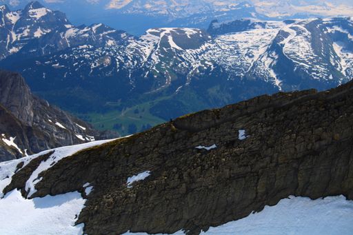 A landscape of the Santis covered in the snow under the sunlight in Switzerland