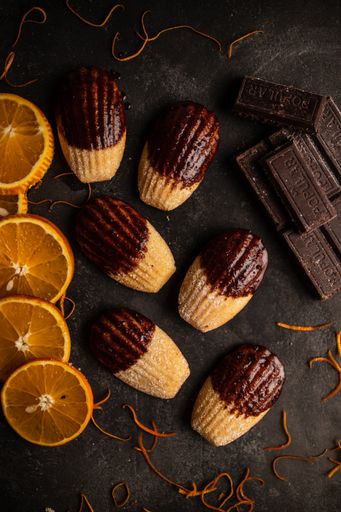 An overhead shot of homemade orange cookies with chocolate