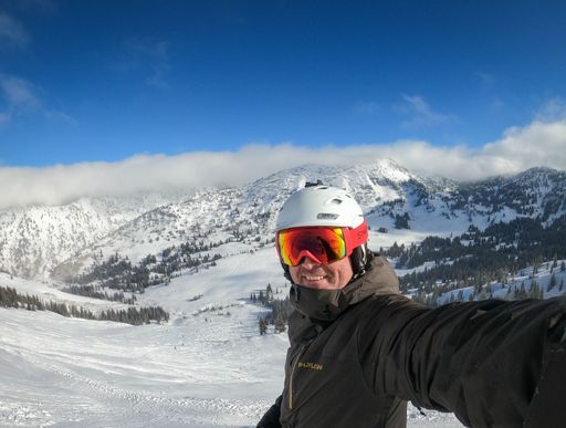 A joyful skier enjoying the snowy slopes in Colorado mountains