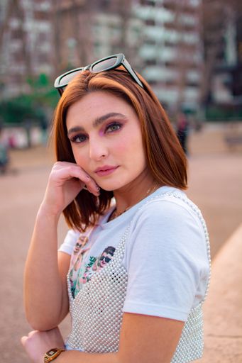 A shallow focus shot of a beautiful Argentinian female posing at camera