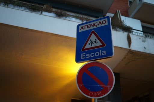 A no parking sign on the background of a building