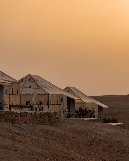 tents at a tourist camp during the sunrise in Agafay desert, near to Marrakesh, Morocco, North Africa.