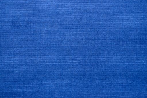 A bright blue textile background