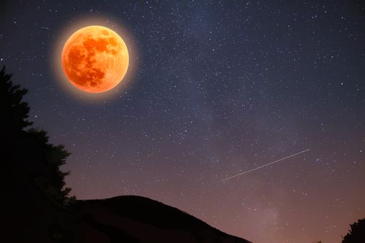 The bloody full Moon in the starry sky