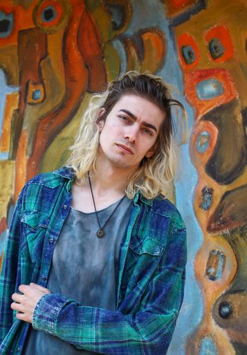 Attractive blond male model with longer hair