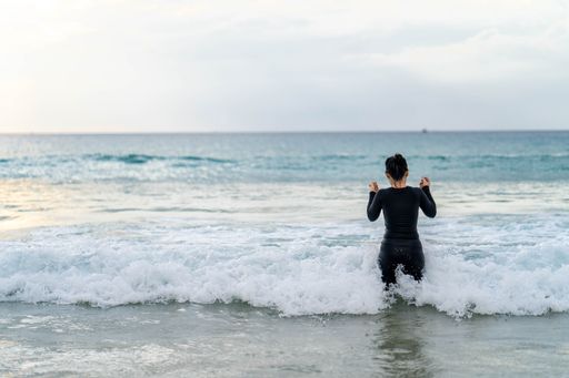 A young woman enjoying and having fun at the beach
