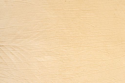 A top view of sand with lines on it