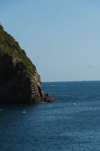 A vertical shot of the cliff on the seashore at daylight