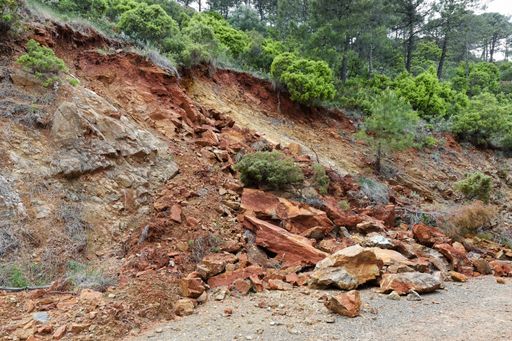 A view of a small landslide on side of a steep hill after heavy rainfall showing Peridotite rocks, Spain